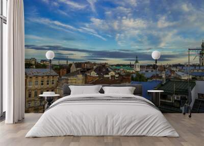 old city roof top aerial landmark view photography in Lviv Ukraine with historical buildings and vivid blue sky in evening time Wall mural