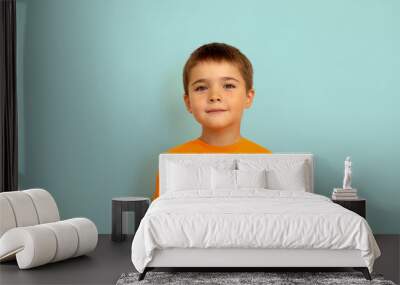 portrait of a child on a light blue background copy space. portrait of a little boy 5 years old Wall mural