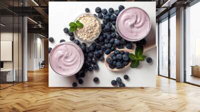 two blueberry yogurt in glasses on a white table, top view, ingredients for cooking diet food Wall mural