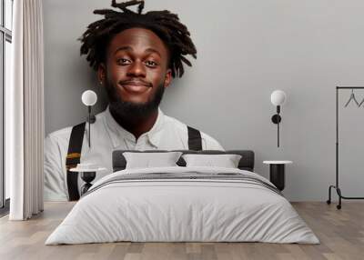 A man with a jheri curl is smiling, holding a notebook Wall mural