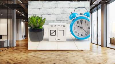 June 7 on the wooden calendar.The seventh day of the summer month, a calendar for the workplace. Summer Wall mural