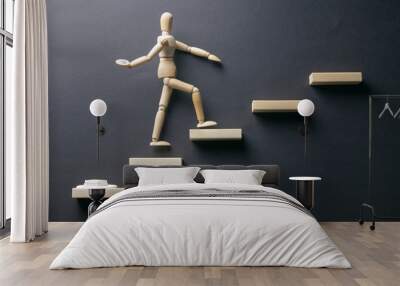 Wooden man walk up the career stairs. Ladder made with wooden bricks. Mannequin on top of development. Concept of personal development, career , changes, success. Black background, copy space for ad Wall mural