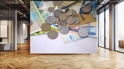 Old and new coins and banknotes of different countries closeup on white background Wall mural