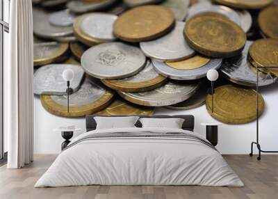 Old and new coins of different countries closeup on white background Wall mural