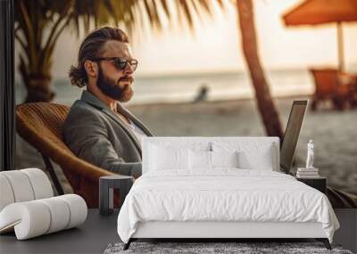 A young man with a beard works on the beach with a laptop. Distant work. Generative AI Wall mural