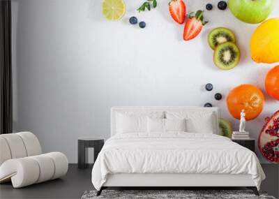 Flatlay assorted fresh and ripe fruits and berries. The concept of healthy eating. Copy space. Wall mural