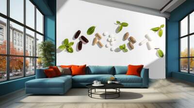 Various vitamins, tablets and dietary supplements with natural formulations on a white background. Wall mural