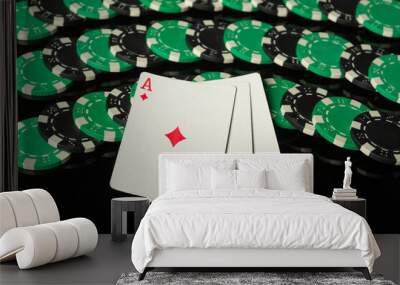 Green chips and playing cards with a winning combination of three kind or set on a black table. Concept of luck or a nice win in a casino Wall mural