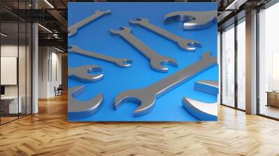 3d illustration of metal keys wrenches of different sizes lie on a blue isolated background, top view. Carpenter tools set close up... Wall mural