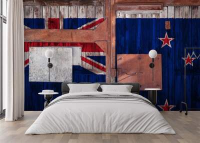 Close-up of old warehouse gate with national flag of New zealand. The concept of export-import New Zealand, storage of goods and national delivery of goods. Flag in grunge style Wall mural