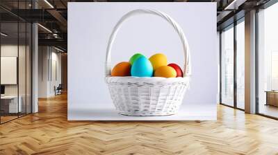 Easteg eggs in the white basket with copy space on white background  Wall mural