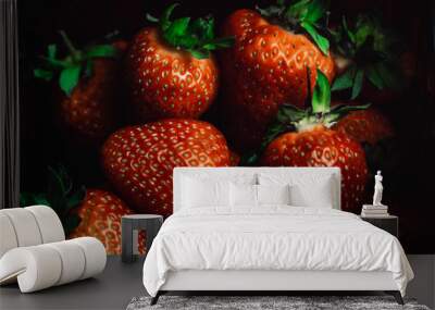 Fresh juicy strawberries with leaves. Strawberry on a red background Wall mural