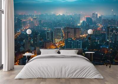 Aerial view of dense urban cityscape at night Wall mural