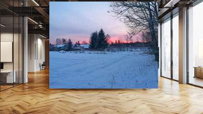 winter evening in the Russian village snow sunset pine trees Wall mural