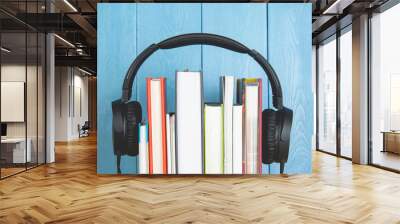 headphone and books on blue background Wall mural