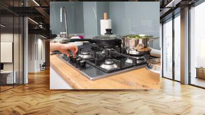 Close up on woman cooking healthy vegetables in bright kitchen Wall mural