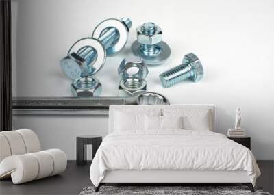 metal nuts and bolts with wrenches on white background Wall mural