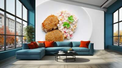 Above view of homemade dish with chicken meal and salad of seafood and parsley. Delicious two piece of grilled chicken with salad on rounded plate. Wall mural