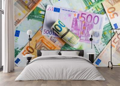 Euro in stationery band on pile of paper banknotes five one hundred and fifty euro. Heap of money Wall mural