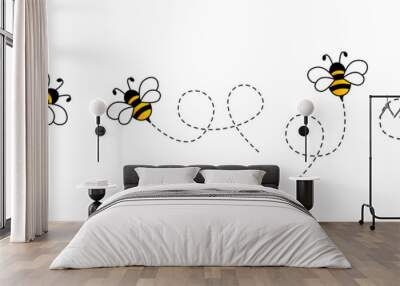 Cartoon bee icon set. Bee flying on a dotted route isolated on the white background. Vector illustration. Wall mural