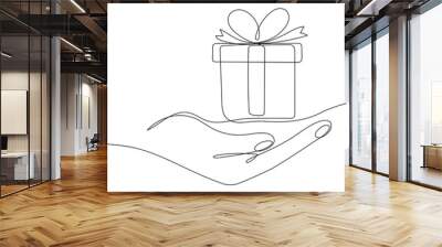 Human hand holding gift box continuous line. One line art drawn surprise. Birthday symbol. Vector isolated on white. Wall mural