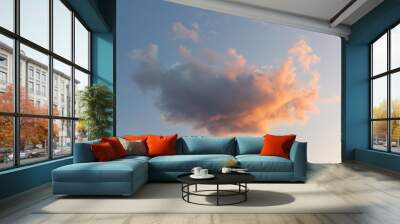 Beautiful fluffy pink cloud in the blue sky at sunset Wall mural