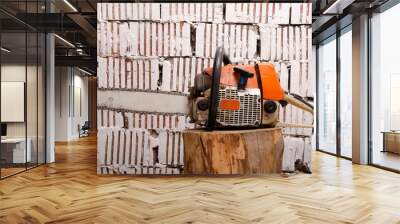 Chainsaw with traces of operation left view Wall mural