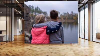 girl and boy are hugging Wall mural