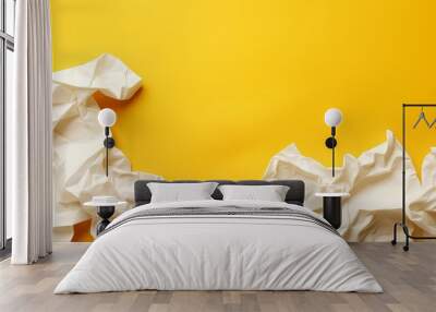 White paper wrinkled on bright yellow surface. Wall mural