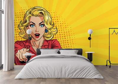 
Young woman in pop art style smiles and points her finger at you. On a yellow background. Pop art in vector comic style Wall mural