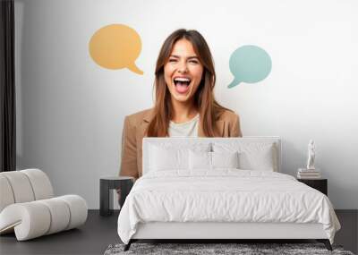 a beautiful smiling girl is texting in a messenger on her phone , speech bubbles, on a white background Wall mural