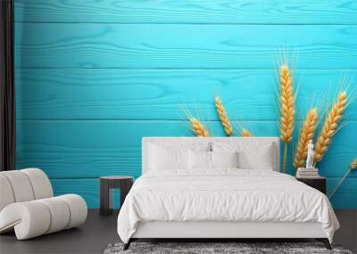 yellow ears of wheat on a blue wooden background Wall mural