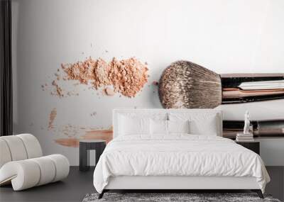 powder slide, a touch of foundation and two black makeup brushes Wall mural