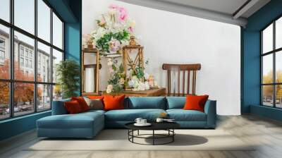 Bouquets of flowers, wooden old chairs and decorative street candle lanterns. Decoration for house Wall mural