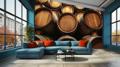 Stacked wooden wine barrels in rustic cellar Wall mural