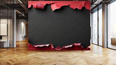 There is a hole in a piece of bright red paper placed on a black background Wall mural