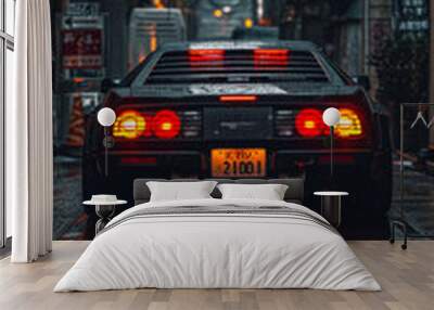 A black car with the license plate number 21001 is driving down a wet street. The car is surrounded by reflections of lights and the street signs, creating a moody and atmospheric scene Wall mural