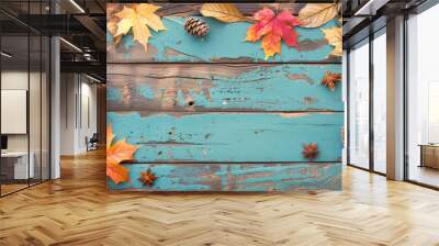 A blue background with a frame of autumn leaves and pine cones. Scene is warm and cozy, with a sense of the season changing Wall mural