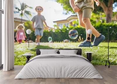 children playing on the artificial lawn, with bubbles floating in the air and a sunny atmosphere. Wall mural