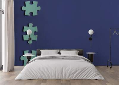 three puzzle pieces on blue background.copyspace for text. Wall mural