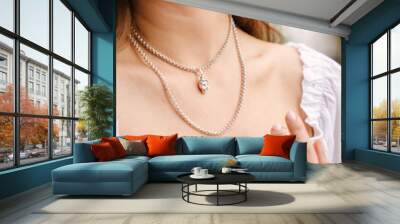 Close-up of a female jewelry on a girl's neck, a beautiful silver necklace Wall mural