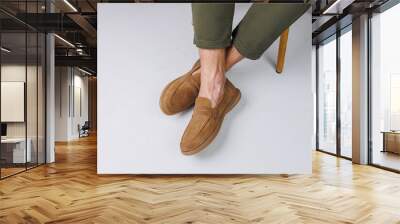 Male feet in brown suede casual shoes. Men's fashionable shoes Wall mural