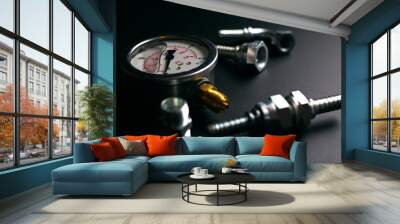 gauge and hydraulic fittings on a black background Wall mural