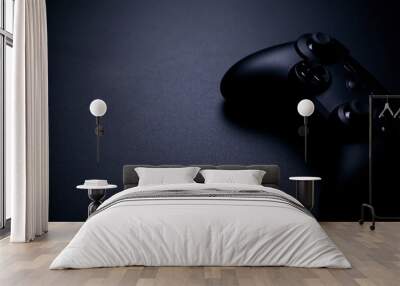 video game controller isolated on black background Wall mural