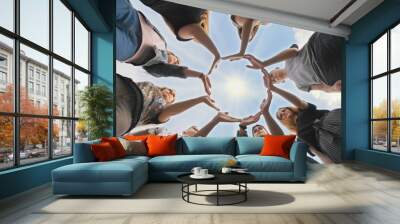 Conceptual symbol of cooperation diverse hands making a circle. Wall mural