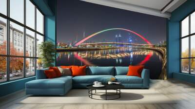 Panorama of night Dubai on the background of the bridge of the Dubai Greek canal. Wall mural