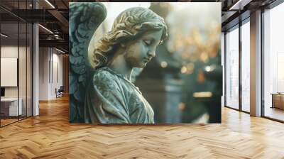 A detailed view of an angel statue's face, perfect for use in decorative or spiritual contexts Wall mural