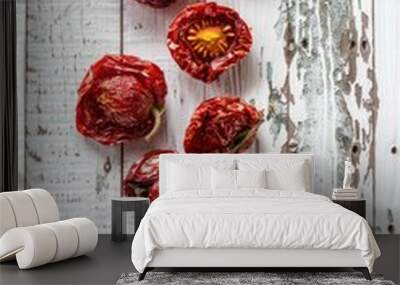 A group of red peppers sitting on top of a wooden table Wall mural