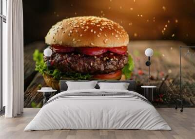 A juicy hamburger topped with lettuce, tomato, and onion served on a wooden table Wall mural