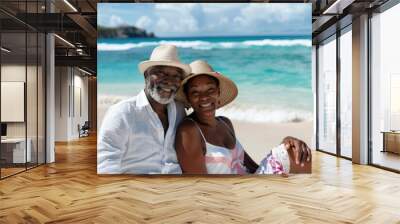 A man and a woman sitting together on a sandy beach, enjoying the scenery Wall mural